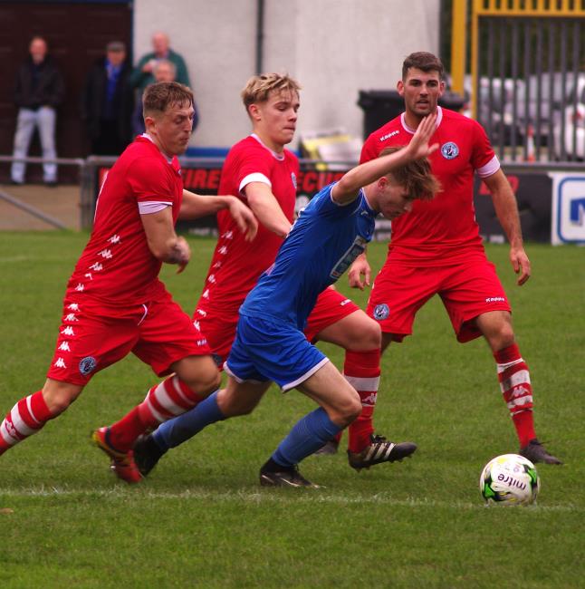 Haverfordwest County striker Dan Williams is surrounded